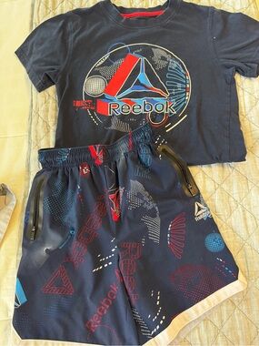 Reebok Navy Graphic Tee and Athletic Shorts with Red & Blue Accents.